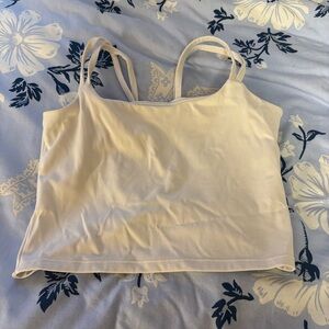 White cropped athletic tank top with open twist back and double straps